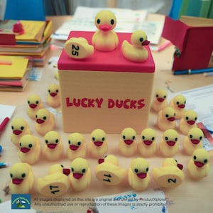 May include: A yellow box with the words "LUCKY DUCKS" printed on the front. The box is filled with yellow rubber duckies, each with a number printed on the bottom. The numbers on the ducks are 25, 11, 17, and 2.