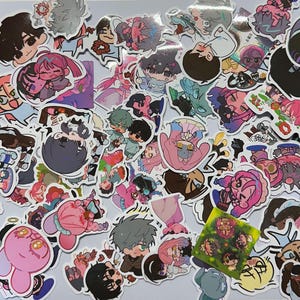 May include: A collection of colorful anime character stickers featuring a variety of characters, poses, and expressions. The stickers are printed on white paper and have a glossy finish.