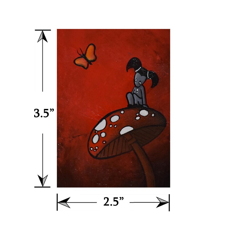 May include: A whimsical painting featuring a figure with black pigtails seated on a mushroom with white spots. An orange butterfly hovers nearby against a red background. The artwork measures 3.5 inches by 2.5 inches.
