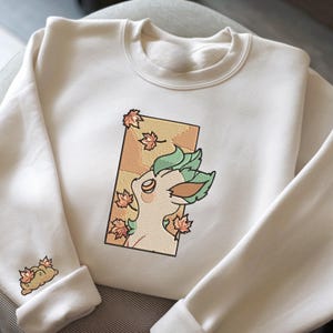 刺繍 リーフォン PKM スウェットシャツ、リーフォン 草の緑、刺繍 アニメ T シャツ、PKM 大学、アニメ シャツ、ユニセックス シャツ