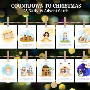 Peut inclure: Un ensemble de 25 cartes de l'Avent de la Nativité, chacune avec une illustration à l'aquarelle et un verset biblique. Les cartes sont suspendues à une ficelle avec des pinces à linge en bois, avec le texte "Countdown to Christmas" en haut.
