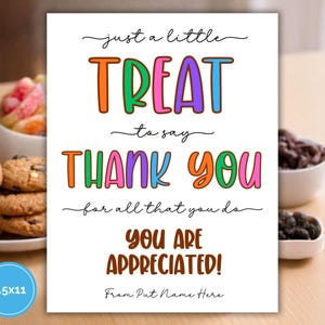 May include: A white 8.5x11 inch sign with the words "just a little TREAT to say THANK YOU for all that you do YOU ARE APPRECIATED!" in colorful, playful lettering. Cookies and candies are in the background.