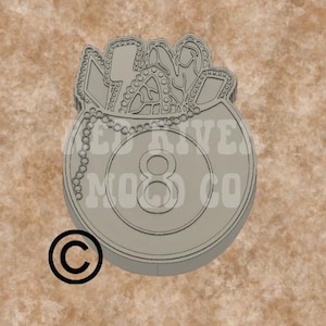 May include: A gray 8-ball pool ball with a chain and a design of a candy cane, lollipop, and other sweets inside. The text "Red River Mod Co" is printed on the ball. The image has a copyright symbol.