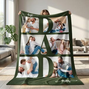 May include: A dark green fleece blanket with the word "DAD" in large white letters. The letters are filled with family photos. The words "best" and "ever" are written in white script.