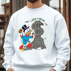 Hilarious Scrooge McDuck money tee for men and women who love cash, wealth, and success. This retro cartoon shirt features the famous duck diving into gold coins, making it a perfect gift for investors, finance lovers, and classic Disney fans!