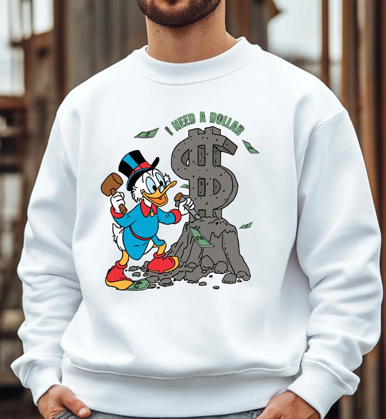 Hilarious Scrooge McDuck money tee for men and women who love cash, wealth, and success. This retro cartoon shirt features the famous duck diving into gold coins, making it a perfect gift for investors, finance lovers, and classic Disney fans!