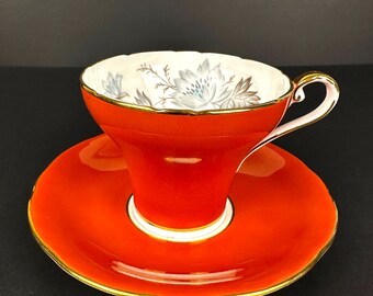 Vintage Aynsley bone china England corset coral tea cup and saucer with exterior and flowers, corset shaped tea cup