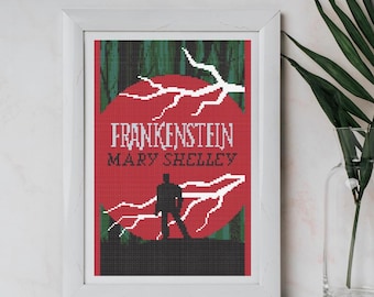 May include: Framed cross-stitch art featuring the novel "Frankenstein" by Mary Shelley. The design includes a red background with white lightning bolts and the silhouette of a figure. The frame is white.