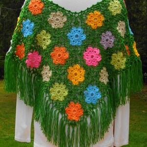 A crochet pattern from Nancy Brown-Designer - a pattern for a poncho crocheted in wild flower motifs. A poncho that is bold, bright and fashion forward. A perfect accessory for spring and all your outdoor activites. Add a wispy fringe at the bottom.