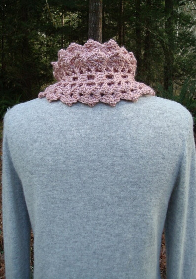 A crochet pattern from Nancy Brown-Designer - a pattern for a quick and easy winter scarf. So warm and cuddly, so quick and easy to make. Crocheted in a heavy worsted or aran weight yarn and the pattern stitch is easy enough for a novice.