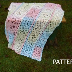 A crochet pattern from Nancy Brown-Designer - a wonderful baby blanket that is crocheted in six join-as-you-crochet strips. Lacy diamonds is a version of spider web lace and crochets up quickly and easily.