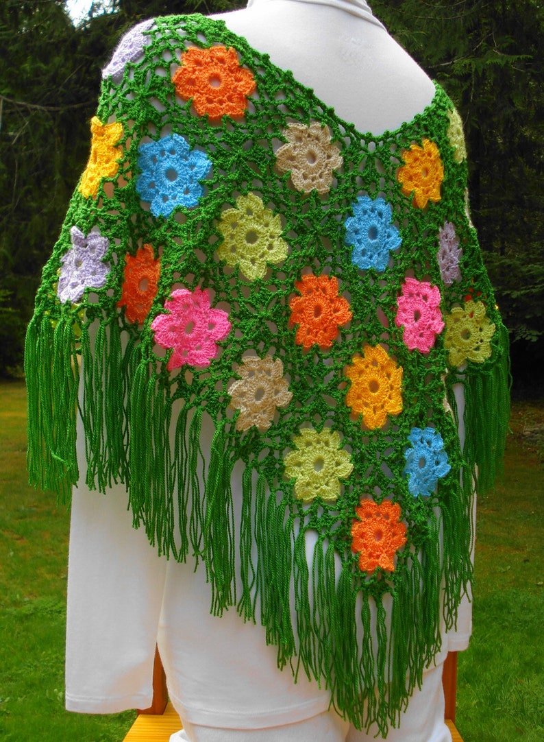 A crochet pattern from Nancy Brown-Designer - a pattern for a poncho crocheted in wild flower motifs. A poncho that is bold, bright and fashion forward. A perfect accessory for spring and all your outdoor activites. Add a wispy fringe at the bottom.