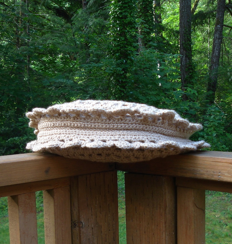 A crochet pattern from Nancy Brown-Designer - a pattern for a doily inspired round bag. Inspired by a simple to crochet doily, this bag is a fashion must-have. Two doilies are crocheted together with a gusset. A strap and button completes the look.