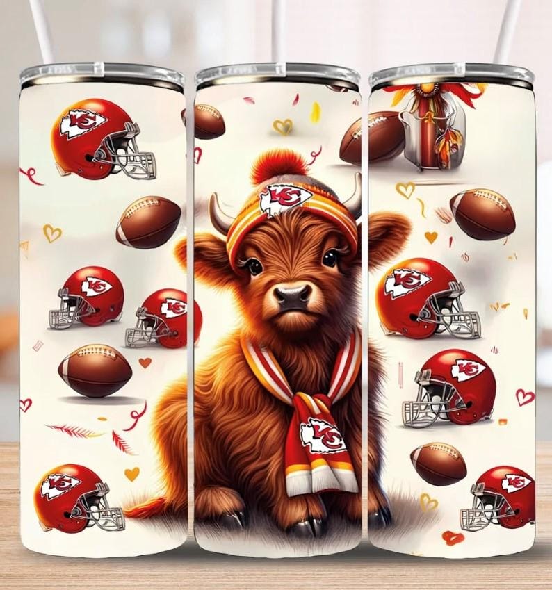 May include: A white tumbler with a brown and white Highland cow wearing a red and yellow hat and scarf. The tumbler has a pattern of footballs and helmets with the Kansas City Chiefs logo.