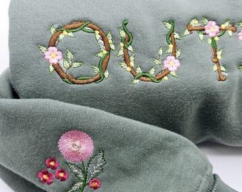 OUTSIDER embroidered luxury Soft Olive Green sweatshirt.  Coordating wildflowers on cuff. Thick, cozy, soft,  with pockets! Women&#39;s Large.