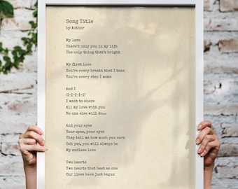 May include: A framed print of a vintage-style love poem with the title "Song Title" and the author's name. The poem is written in a typewriter font and includes the lines "There's only you in my life" and "Our lives have just begun."