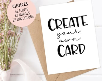 May include: White card with black text that reads "CREATE your own CARD". The card is sitting on a brown envelope. A bouquet of pink flowers is in the background.
