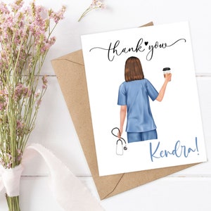 May include: Thank you card with a cartoon illustration of a nurse in blue scrubs holding a cup of coffee. The text on the card reads "thank you Kendra!"