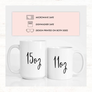 May include: Two white ceramic mugs with black lettering. The larger mug says "15oz" and the smaller mug says "11oz". The mugs are microwave and dishwasher safe. The design is printed on both sides.