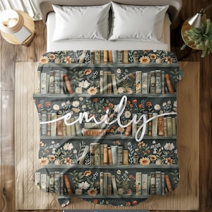 May include: A dark green and brown bookshelf with a floral design and books. The name "emily" is written in white cursive on the bookshelf.