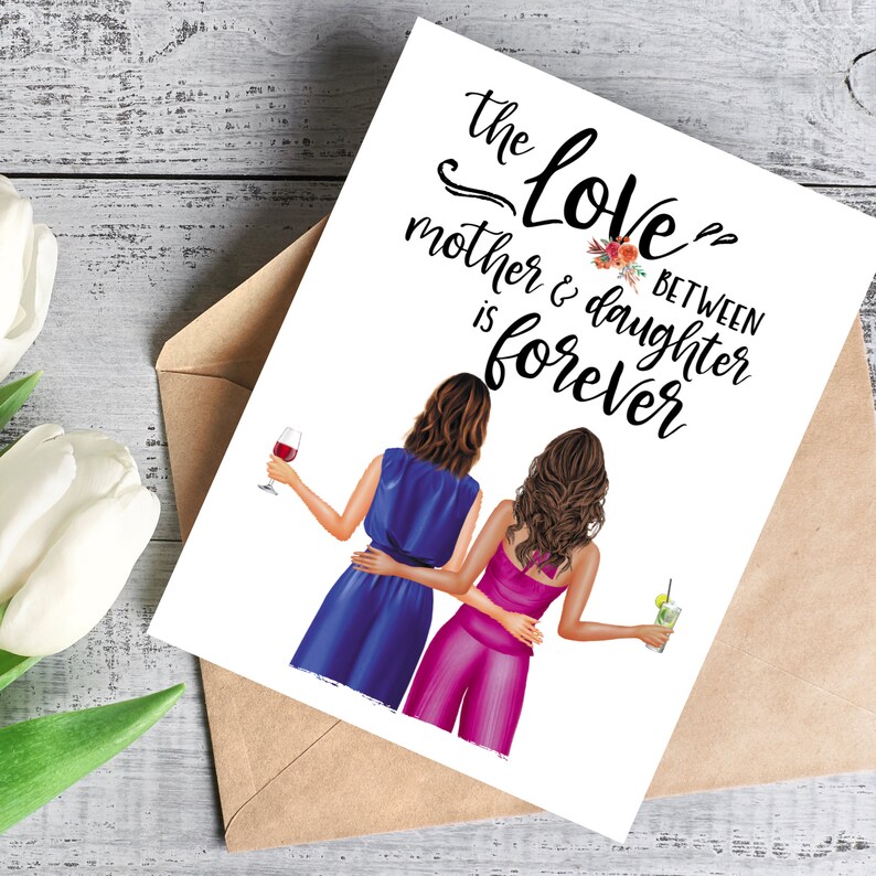 May include: Greeting card with the text "The Love Between Mother & Daughter is Forever." The illustration shows two women embracing, one in a blue dress and the other in a pink jumpsuit, holding drinks. The card is in a brown envelope.
