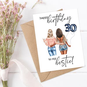 May include: A birthday card with the text "happy birthday to my bestie!" features an illustration of two women, one holding a drink and the other holding a number 30 balloon. The card is on a white surface with a brown envelope and flowers.