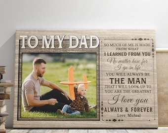 May include: A wooden framed canvas print with the text "TO MY DAD" at the top. The print features a photo of a father and child, with additional text that reads "I love you always & forever".