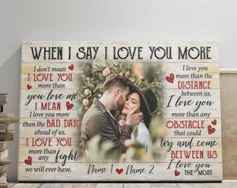 May include: A personalized canvas print with a romantic theme. The print features a couple embracing, surrounded by text that reads "When I Say I Love You More." The design includes hearts and space for names, set against a rustic wooden background.