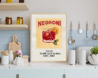 May include: A framed print featuring a Negroni cocktail recipe. The artwork displays a glass of the drink with an orange slice, ice, and basil. The text includes the word "Negroni" in red and the ingredients in German.