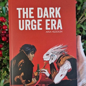 Op de afbeelding: Rode boekomslag met de titel "THE DARK URGE ERA" en de naam van de auteur, ARIA NIZIOLEK, in witte tekst. De cover toont twee figuren, een mens en een alien, zittend aan een tafel. Het boek wordt tegen een achtergrond van groen gebladerte gehouden.