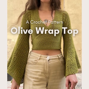 May include: Olive green crochet wrap top with flared sleeves. The top features a V-neck design and is part of a crochet pattern. The text "A Crochet Pattern" and "Olive Wrap Top" are displayed on the image. The bottom of the image reads "CROCHET - by anahid -"