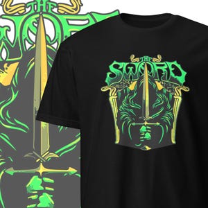 May include: Black t-shirt with a green and yellow graphic design of a sword and the text "The Sword".