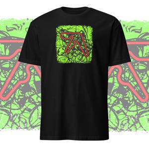 May include: Black t-shirt with a green and red graphic of a stylized letter A. The graphic has a grunge effect.