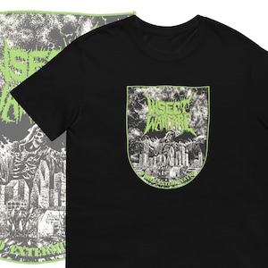 May include: Black t-shirt with a green and white graphic print of a skull and city skyline. The graphic includes the text "WRETCHED WARFARE" and "WORLD EXTERMINATION".