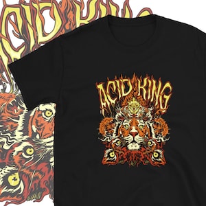 May include: Black t-shirt with a graphic of a tiger's face surrounded by flames and the text "ACID KING" in a stylized font.