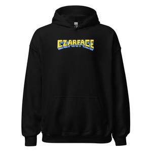 May include: Black hooded sweatshirt with a yellow and blue graphic that says "CZARFACE" on the front.