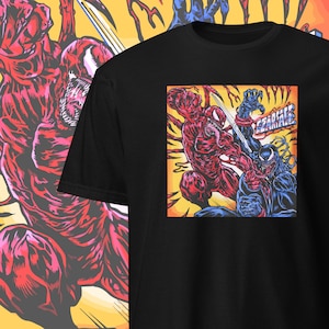 May include: Black t-shirt with a graphic of a red and blue character in a battle pose, with the word "Carnage" in white. The design is set against a yellow and orange background, with a matching design on the side.