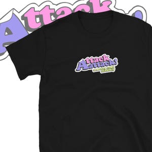May include: Black t-shirt with a purple and pink graphic that says "Attack! Someday came suddenly."