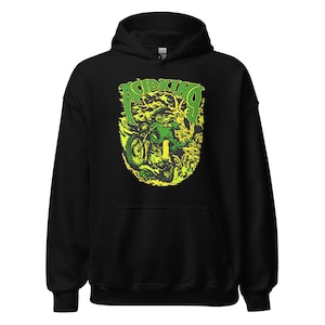 May include: Black hooded sweatshirt with a green and yellow graphic of a person riding a motorcycle with the text "Acid King" above the image.