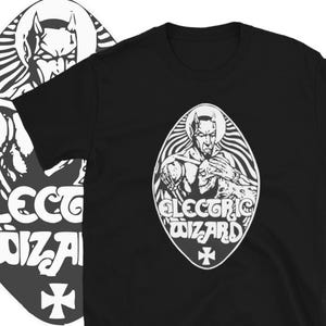 May include: Black t-shirt with a white graphic of a demon holding a skull. The graphic is in a circle with the text "Electric Wizard" below it.