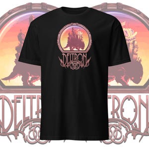May include: Black t-shirt with a graphic of a city on a creature's back inside a circular frame. The text "DELTRON" is below the frame.