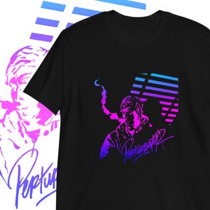 May include: Black t-shirt with a purple and blue graphic of a person with a microphone and the text "Popkupator" in a stylized font.