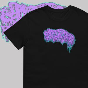May include: Black t-shirt featuring a purple and teal graphic design. The design appears to be a stylized, dripping blob. The graphic is centered on the front of the shirt. The shirt is made of a soft material.