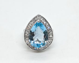 Sterling Silver Blue Topaz Ring: Teardrop Gemstone, CZ Accents