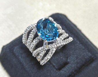 Sterling Silver Blue Topaz Ring: Oval Gemstone, CZ Accents