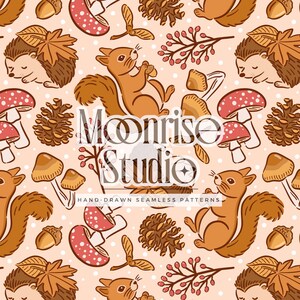 May include: Seamless pattern featuring squirrels, hedgehogs, mushrooms, acorns, and leaves in shades of brown, orange, and red on a light peach background. The text "Moonrise Studio" and "Hand-Drawn Seamless Patterns" are also visible.
