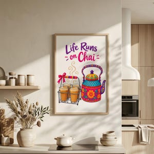 May include: A framed wall art print featuring the text Life Runs on Chai in purple and pink. The illustration displays a colorful patterned teapot next to a metal carrier holding four glasses of tea with steam rising above the glasses.