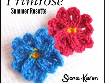 May include: Two crocheted flowers, one blue and one red, with yellow centers. The flowers are called "Primrose Summer Rosette" and are made by Siona Karen, Naturally Inspired Crochet.