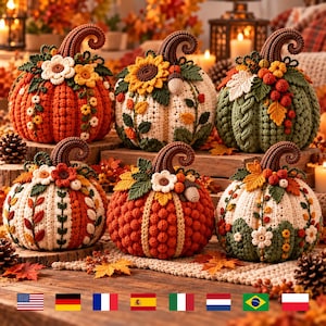 May include: A collection of six decorative crochet pumpkins in various colors including orange, cream, and green. Each pumpkin features a textured surface with intricate yarn details, including crocheted flowers, leaves, berries, and curled stems.