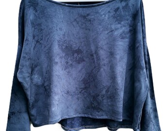 May include: A blue tie-dye long-sleeve shirt with a relaxed fit and a slightly cropped hem.
